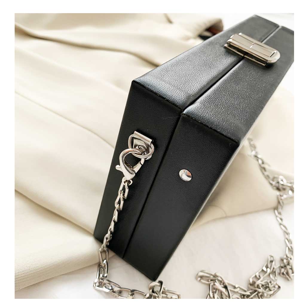 Side view of retro evening bag showing clasp and structure